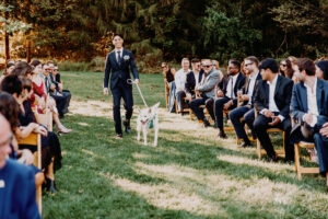Groom walks his white dog down the aisle at his wedding in Ohio